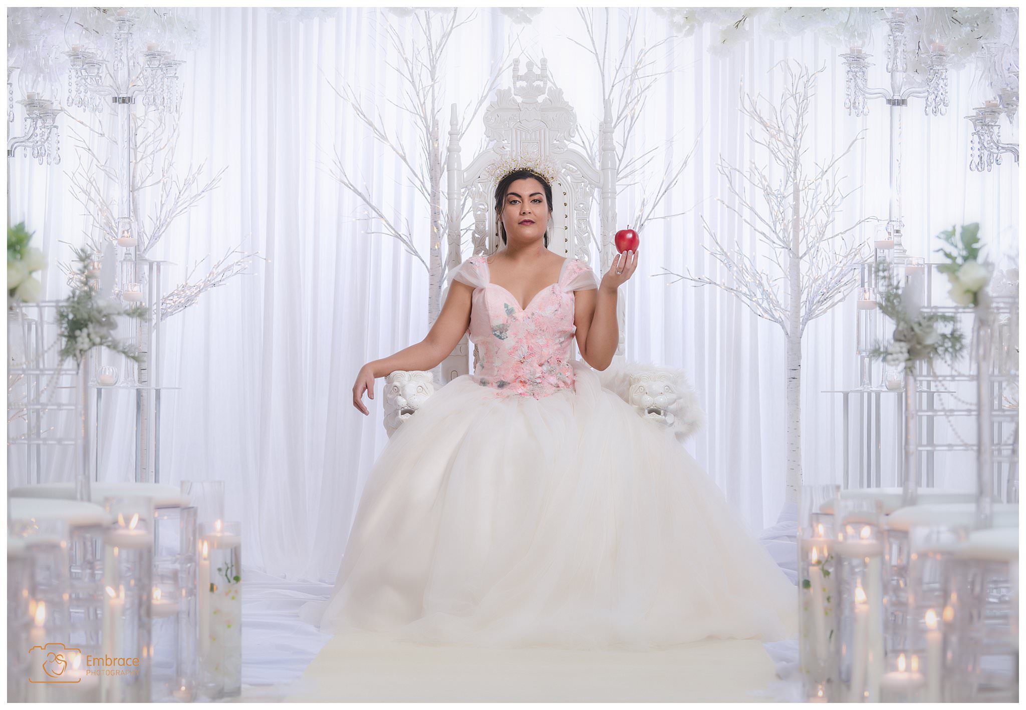 Model Bride Melissa Porter holding apple for fairytale wedding photo shoot